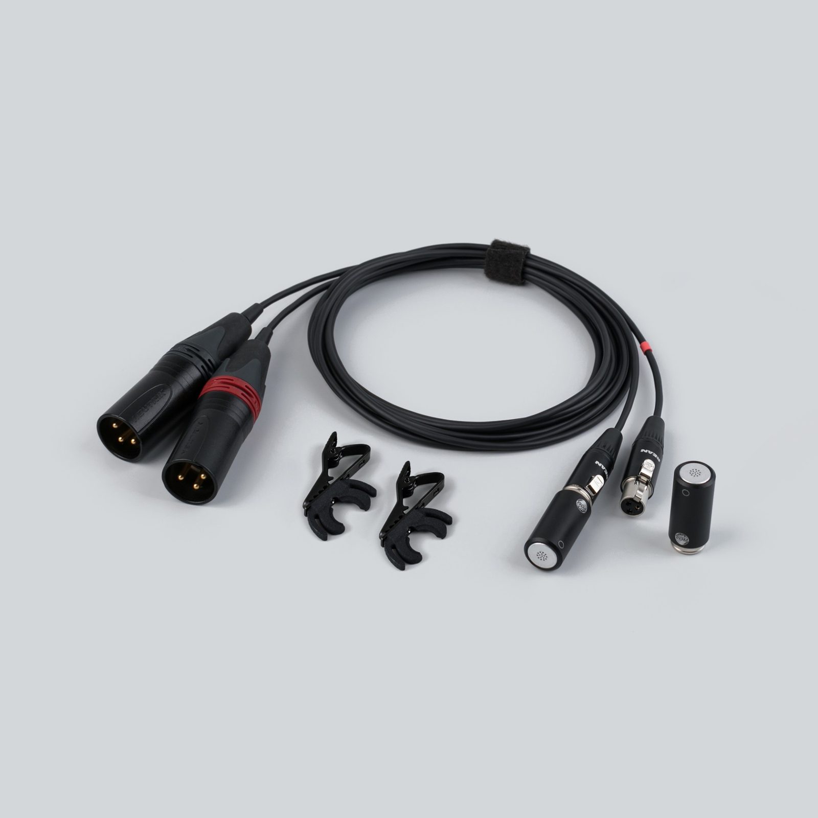 A pair of LOM microphones with their cable, XLR connectors and clips